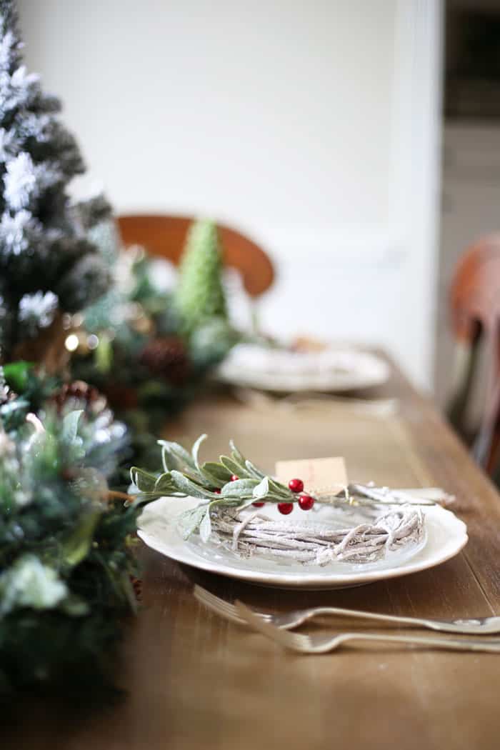 Christmas Table Decor | This Christmas table is gorgeous and adds tons of green and red to your holiday home! #christmas #christmastabledecor #christmasdecor #christmasdecorating #holidaytable #christmastablescape